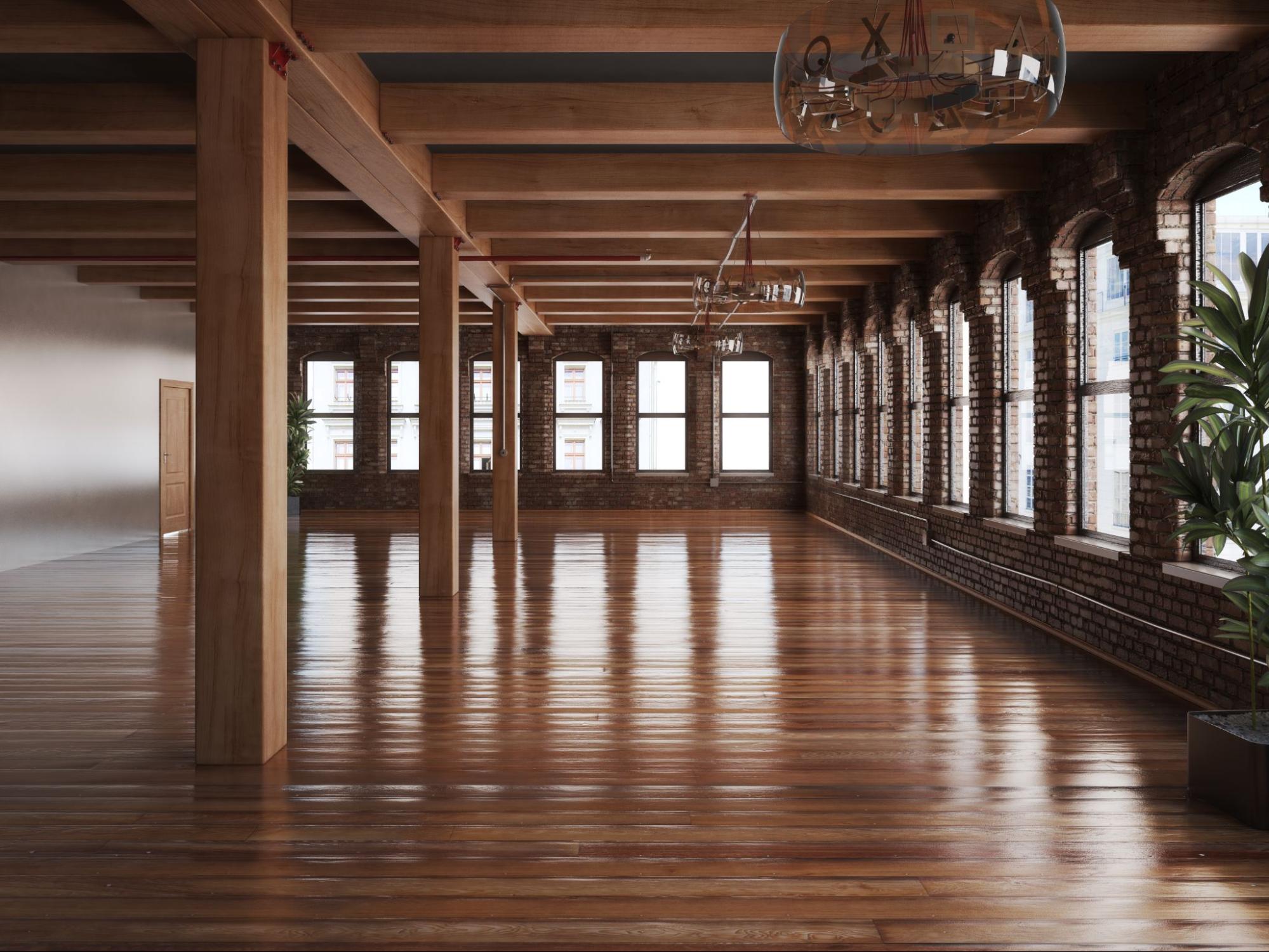 A building hall featuring wooden accents and a polished hardwood floor.