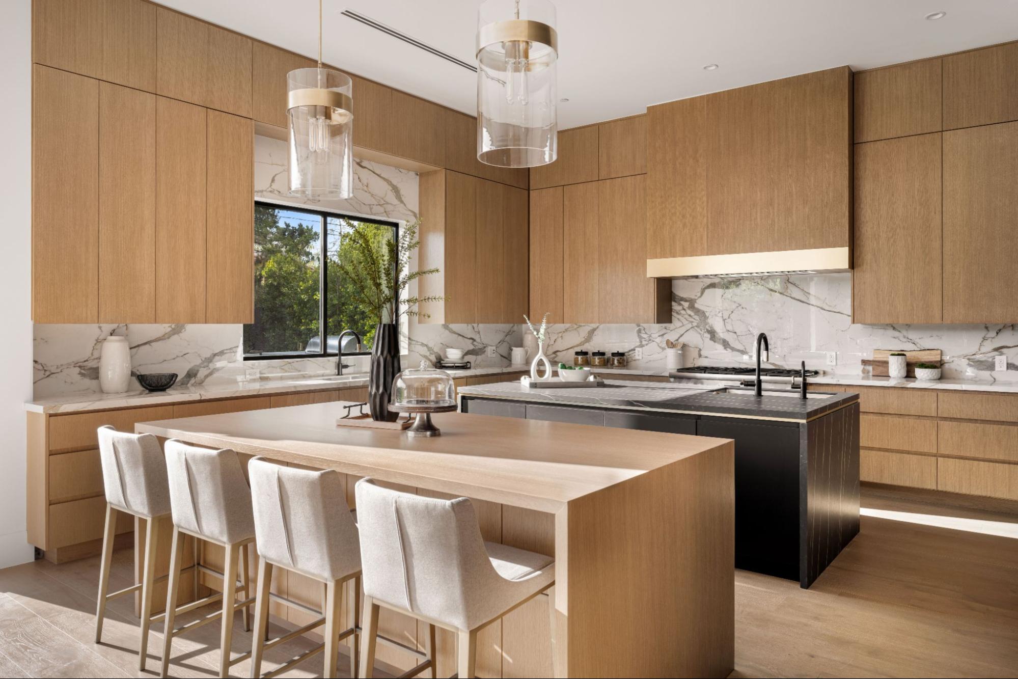 Modern kitchen featuring wooden cabinets and white marble countertops for a clean, natural look.