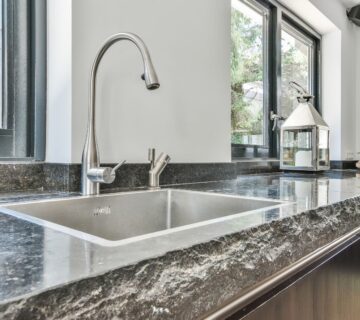 Modern kitchen design featuring a sleek black marble countertop 