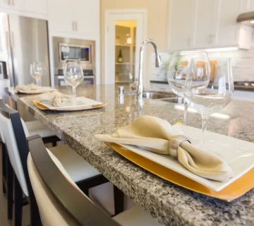 Top down shot of a quartz countertop with jars and fruits on its surface 